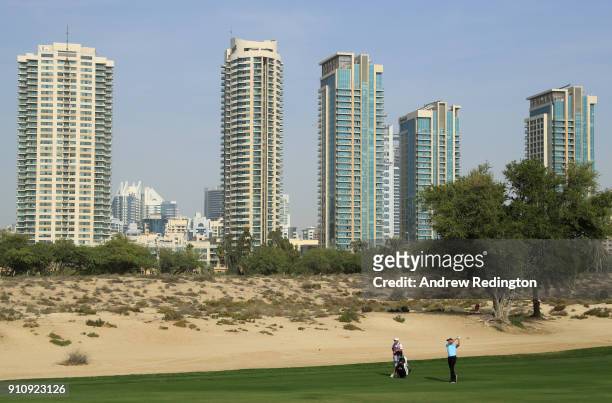 Ian Poulter of England plays his second shot on the 8th hole during day three of Omega Dubai Desert Classic at Emirates Golf Club on January 27, 2018...