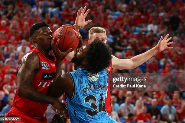 Derek Cooke Jr. And Jesse Wagstaff of the Wildcats look to block Rakeem Christmas of the Breakers during the round 16 NBL match between the Perth...