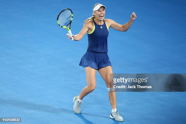 Caroline Wozniacki of Denmark celebrates winning championship point in her women's singles final against Simona Halep of Romaniaon day 13 of the 2018...