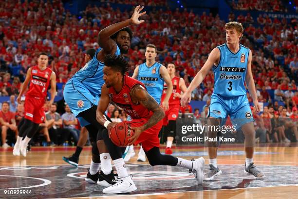 Jean-Pierre Tokoto of the Wildcats works to the basket against Rakeem Christmas of the Breakers during the round 16 NBL match between the Perth...