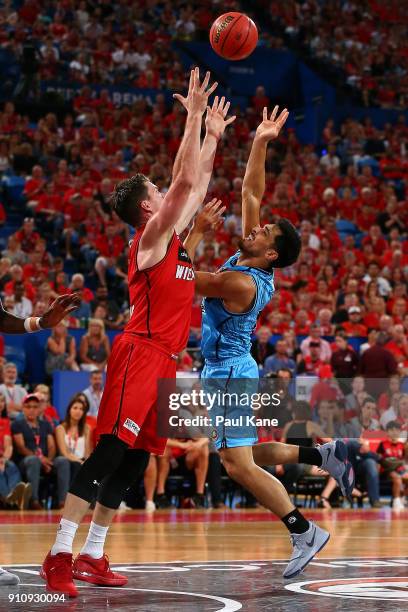 Shea Ili of the Breakers puts a shot up against Lucas Walker of the Wildcats during the round 16 NBL match between the Perth Wildcats and the New...