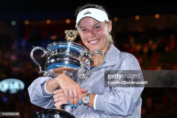 Caroline Wozniacki of Denmark poses for a photo with the Daphne Akhurst Memorial Cup after winning the women's singles final against Simona Halep of...