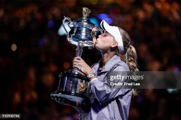 Caroline Wozniacki of Denmark poses for a photo with the Daphne Akhurst Memorial Cup after winning the women's singles final against Simona Halep of...