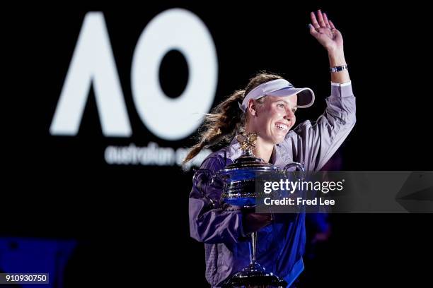 Caroline Wozniacki of Denmark poses for a photo with the Daphne Akhurst Memorial Cup after winning the women's singles final against Simona Halep of...