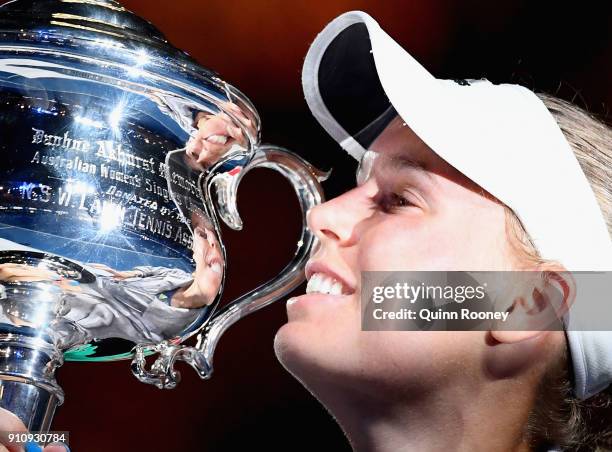 Caroline Wozniacki of Denmark poses for a photo with the Daphne Akhurst Memorial Cup after winning the women's singles final against Simona Halep of...