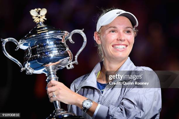 Caroline Wozniacki of Denmark poses for a photo with the Daphne Akhurst Memorial Cup after winning the women's singles final against Simona Halep of...