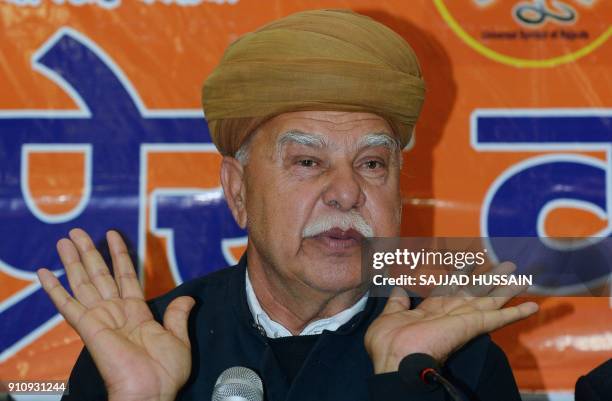 Rajput Karni Sena chief Lokendra Singh Kalvi addresses a press conference in New Delhi on January 27, 2018. Thousands of police in riot gear guarded...