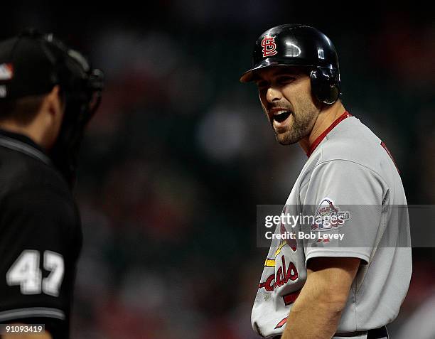 Third baseman Mark DeRosa of the St. Louis Cardinals argues with home plate umpire Mark Wegner after being called out on strikes at Minute Maid Park...