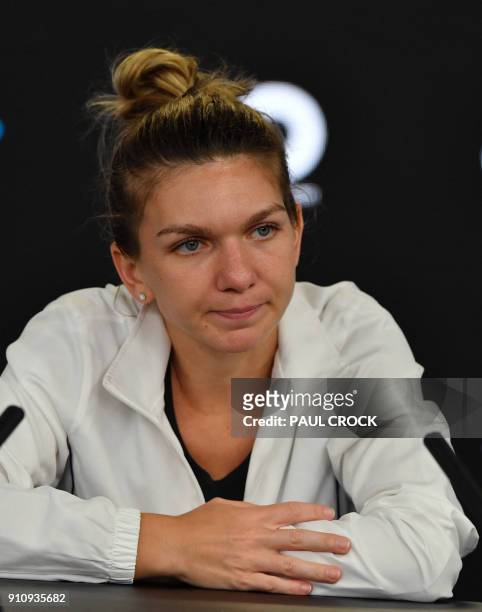 Romania's Simona Halep attends a press conference after losing to Denmark's Caroline Wozniacki in their women's singles final match on day 13 of the...