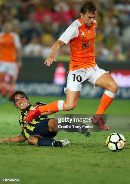 Brett Holman of the Roar contests the ball with Lachlan Wales of the Mariners during the round 18 A-League match between the Central Coast Mariners...