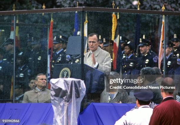 President George HW Bush speaks during the eighth annual National Peace Officers' Memorial Day service on the West Front of the US Capitol,...
