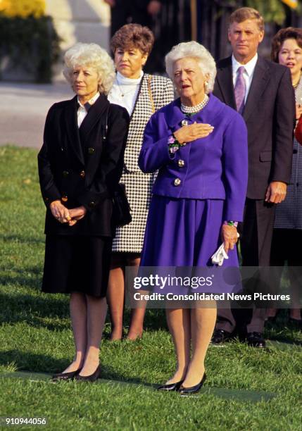 View of Czech First Lady Olga Havlova and US First Lady Barbara Bush as they attend a State Arrival ceremony from the Havels on White House's South...