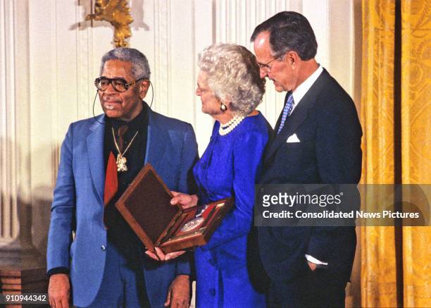 American Jazz composer and musician Dizzy Gillespie is awarded the National Medal of Arts by US First Lady Barbara Bush and President George HW Bush...