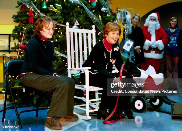 With Stephanie Chapman seated beside her, US First Lady Laura Bush introduces her Scottish Terrier, Barney Bush, at the Children's National Medical...