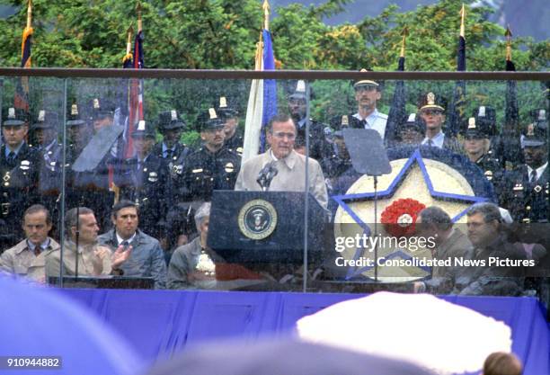 President George HW Bush speaks during the eighth annual National Peace Officers' Memorial Day service on the West Front of the US Capitol,...