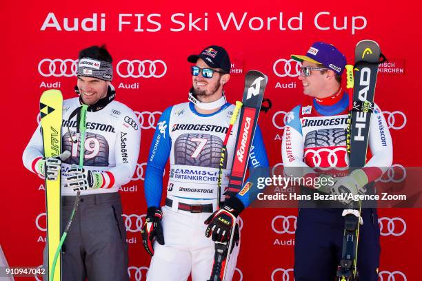 Vincent Kriechmayr of Austria takes 2nd place, Dominik Paris of Italy takes 3rd place, Beat Feuz of Switzerland takes 1st place during the Audi FIS...