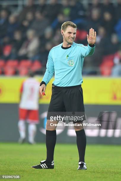 Referee Timo Gerach gestures during the Second Bundesliga match between SSV Jahn Regensburg and FC Ingolstadt 04 at Continental Arena on January 26,...