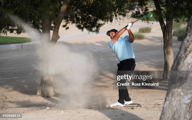 Alexander Levy of France plays his second shot on the 16th hole during day three of Omega Dubai Desert Classic at Emirates Golf Club on January 27,...