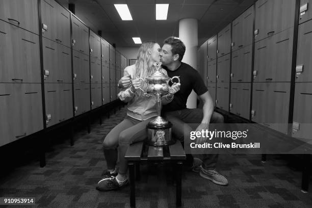 Caroline Wozniacki of Denmark and fiance David Lee pose with the Daphne Akhurst Trophy in the locker-room after winning the Women's Singles Final...