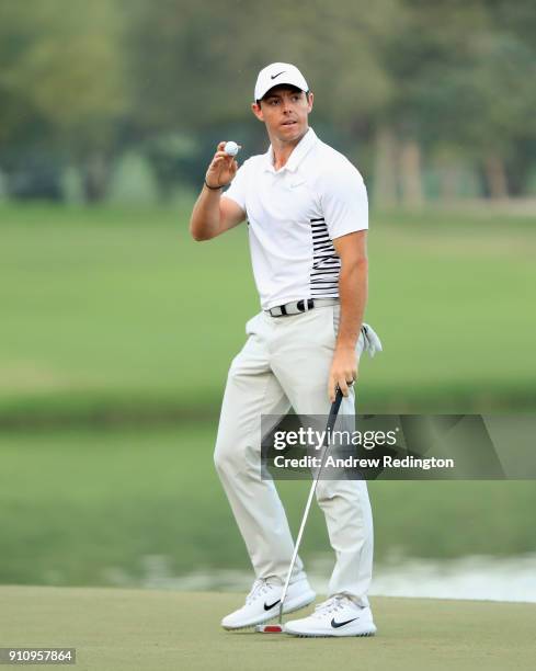 Rory McIlroy of Northern Ireland waves to the crowd after his birdie on the 18th hole during the third round of the Omega Dubai Desert Classic at...