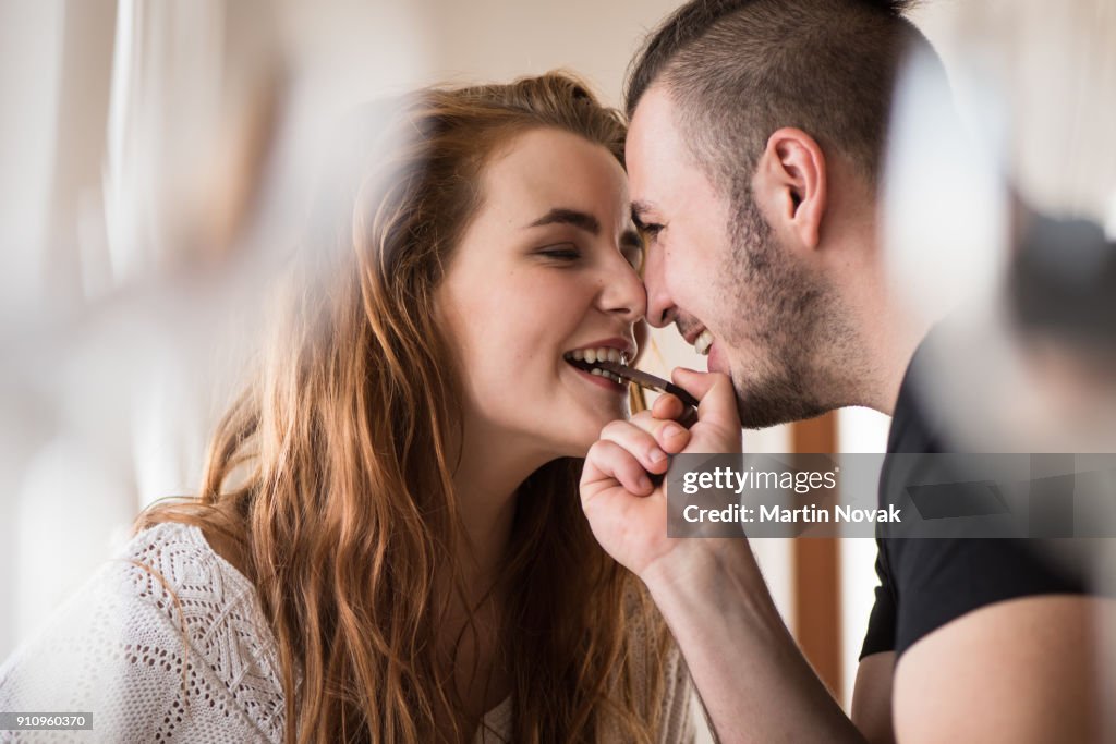 Closeness of a couple while sharing chocolate