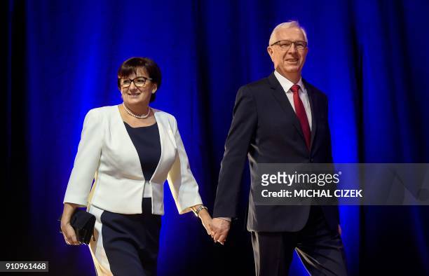 Former head of the Czech Academy of Sciences Jiri Drahos and his wife Eva arrive on the stage to greet their supporters at his campaign headquarters...