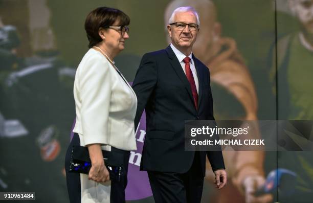 Former head of the Czech Academy of Sciences Jiri Drahos and his wife Eva arrive on the stage to greet their supporters at his campaign headquarters...