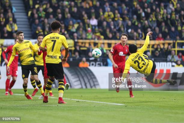 Shinji Kagawa of Dortmund scores a goal to make it 1:0 during the Bundesliga match between Borussia Dortmund and Sport-Club Freiburg at Signal Iduna...