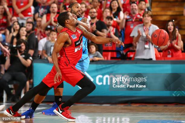 Bryce Cotton of the Wildcats gets fouiled by DJ Newbill of the Breakers during the round 16 NBL match between the Perth Wildcats and the New Zealand...