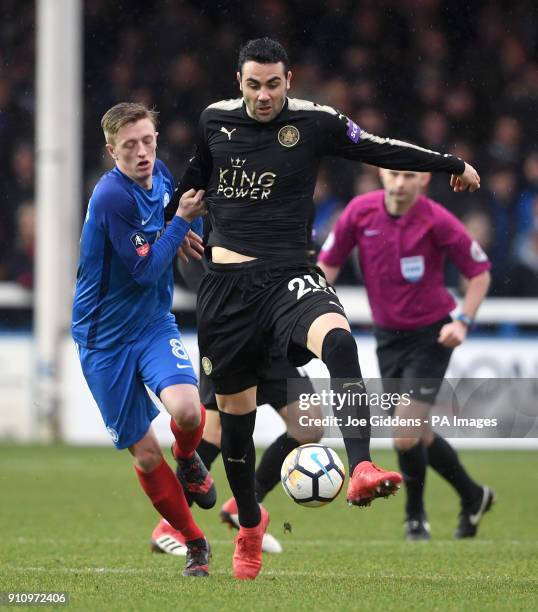 Leicester City's Vicente Iborra and Peterborough United's Chris Forrester battle for the ball during the Emirates FA Cup, fourth round match at The...