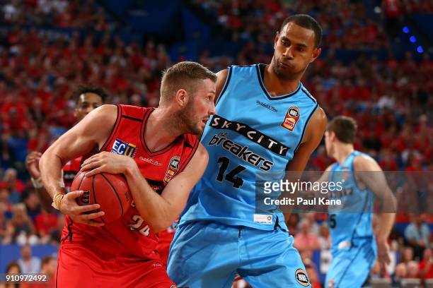 Jesse Wagstaff of the Wildcats holds the ball off Mika Vukona of the Breakers during the round 16 NBL match between the Perth Wildcats and the New...