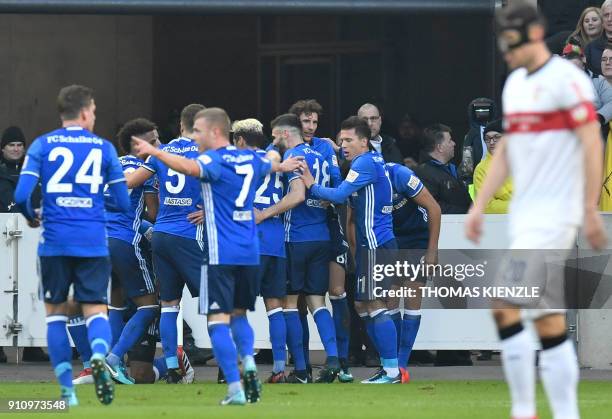 Schalke's players celebrate after Brazilian defender Naldo scored the opening goal during the German first division Bundesliga football match VfB...