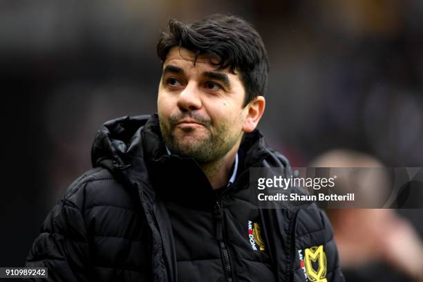 Dan Micciche, Manager of Milton Keynes Dons looks on prior to The Emirates FA Cup Fourth Round match between Milton Keynes Dons and Coventry City at...