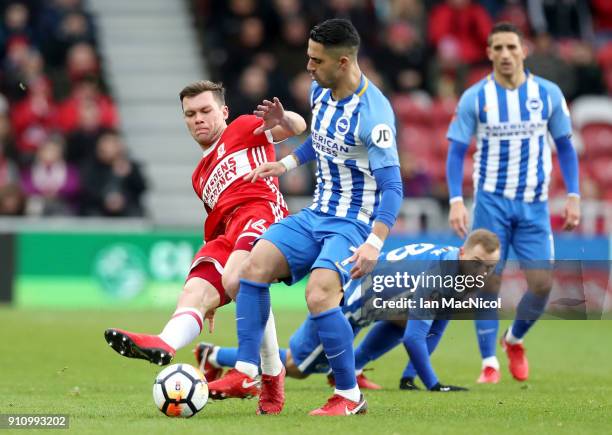 Jonny Howson of Middlesbrough and Biram Kayal of Brighton and Hove Albion battle for the ball during The Emirates FA Cup Fourth Round match between...