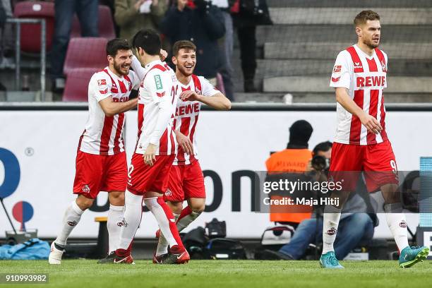 Milos Jojic of 1.FC Koeln celebrates with his team-mates after scoring his teams first goal to make it 1-0 during the Bundesliga match between 1. FC...
