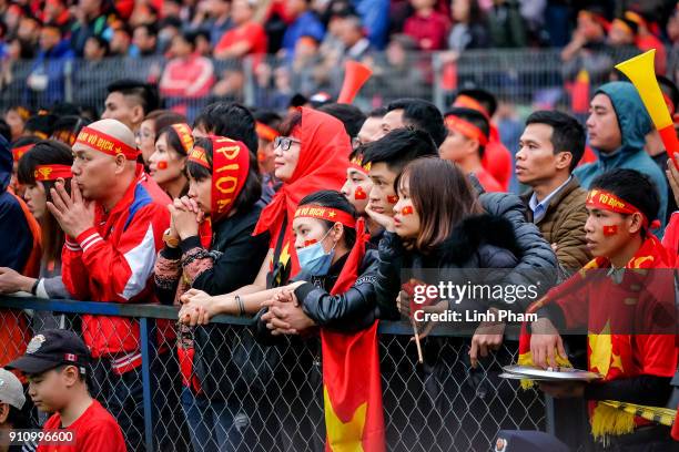 Thousands of Vietnamese soccer fans gather at Hang Day stadium to watch live the final match of the Asian Football Confederation's championship...