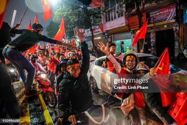 Thousands of Vietnamese soccer fans pour into Hanoi's city center to celebrate U-23 Vietnam's silver medals at the Asian Football Confederation's...