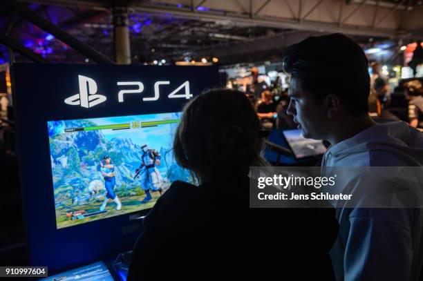 Participants play with the game console PS4 a video games at the 2018 DreamHack video gaming festival on January 27, 2018 in Leipzig, Germany. The...