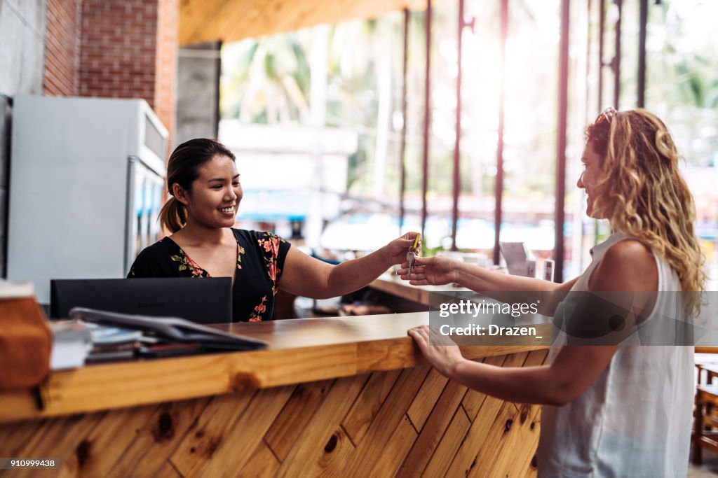 Tourists are checking in the hotel