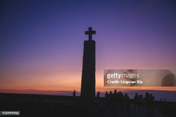 silhouette of monument declaring cabo da roca as the end of europe, sintra, portugal - camões stock pictures, royalty-free photos & images