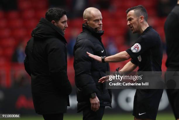 Referee Keith Stroud has words with Bristol City manager Lee Johnson during the Sky Bet Championship match between Bristol City and Queens Park...