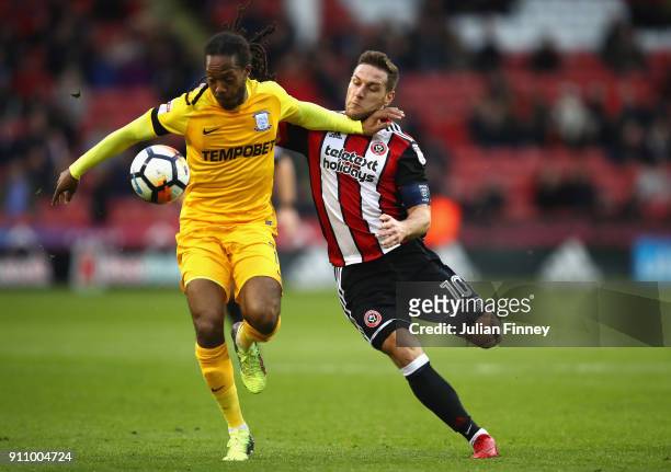 Daniel Johnson of Preston North End is challenged by Billy Sharp of Sheffield United during The Emirates FA Cup Fourth Round match between Sheffield...