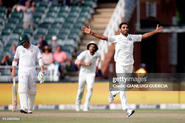 Indian bowler Bhuvneshwar Kumar celebrates the dismissal of South African batsman Kagiso Rabada during the fourth day of the third Test match between...