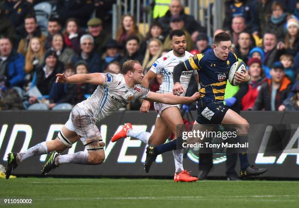 Josh Adams of Worcester Warriors is tackled by Tom Lawday of Exeter Chiefs during the Anglo-Welsh Cup match between Worcester Warriors and Exeter...