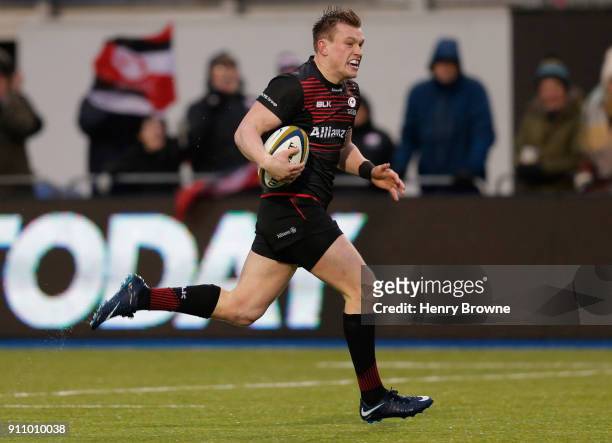 Nick Tompkins of Saracens runs in to score a try during the Anglo-Welsh Cup match between Saracens and Dragons at Allianz Park on January 27, 2018 in...