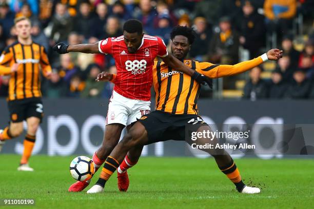 Nottingham Forest's Mustapha Carayol holds off Hull City's Ola Aina during the Emirates FA Cup Fourth Round match between Hull City and Nottingham...