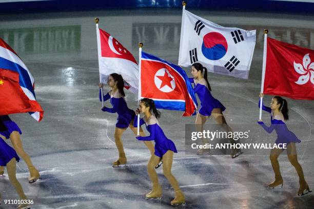 Performers skate with the flags of participating countries during the closing gala exhibition of the ISU Four Continents figure skating championships...