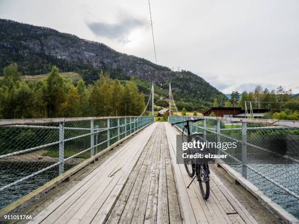 riding a bike in norway - olden foto e immagini stock