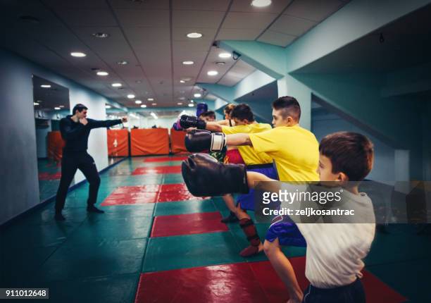 kickboxing training for child - kid boxing stock pictures, royalty-free photos & images