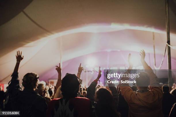 crowd at a music festival - tent stock pictures, royalty-free photos & images